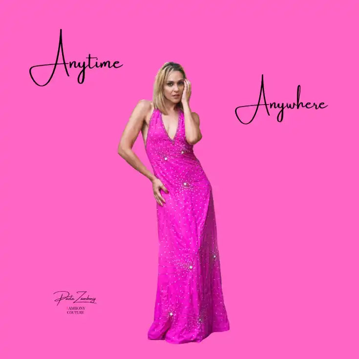 A full-length, hot pink halter gown adorned with sparkling embellishments.