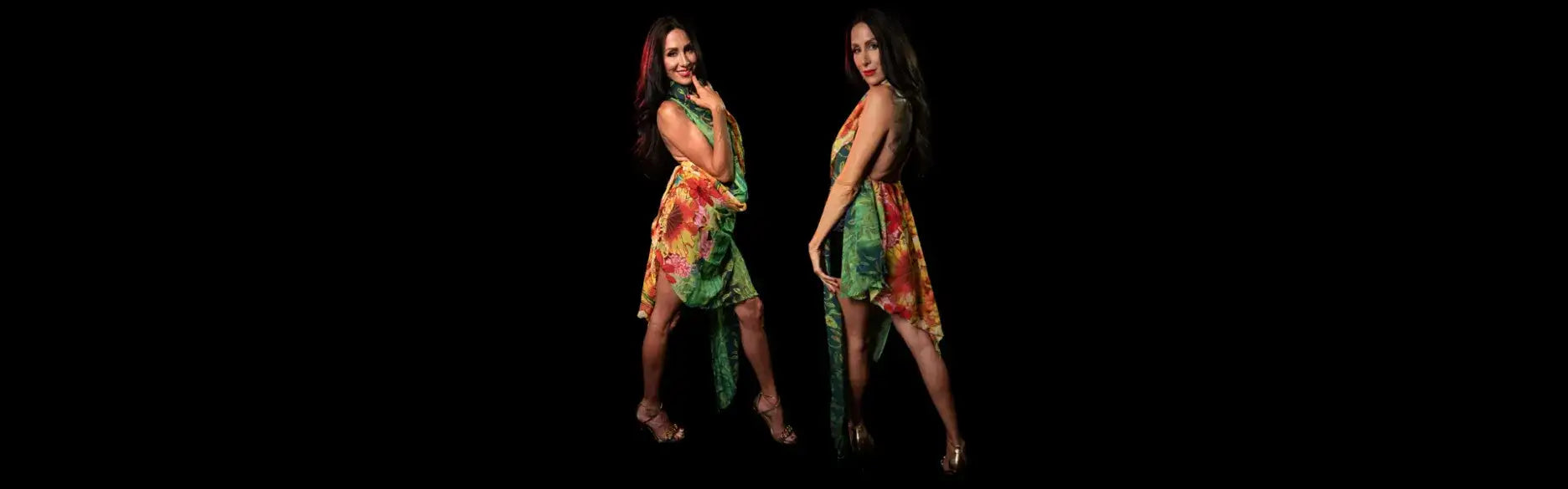 Floral print mini dress with green and orange hues, made of lightweight fabric.