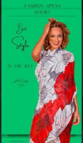 A woman wearing a flowing, long white dress with large red and gray floral patterns.
